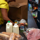 Clients stock up on goods at a New York City supermarket-style food pantry. (Spencer Platt/Getty Images)